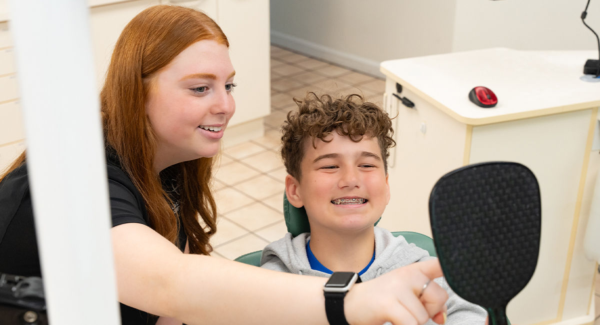 Teenagers smiling with braces
